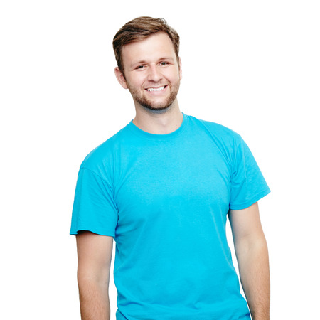 Portrait of a smiling man in blue t-shirt in a studio over a white backgroundの写真素材