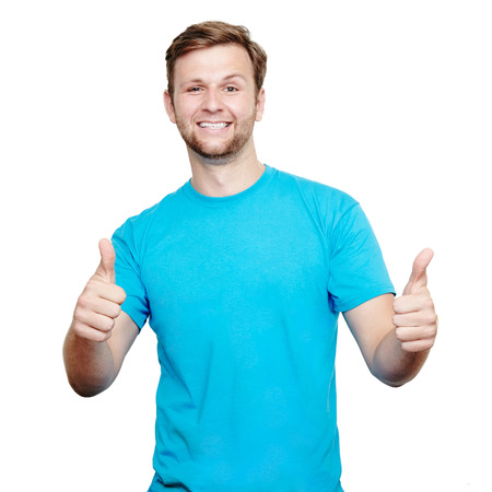 Happy man giving thumbs up sign isolated over white background.の写真素材