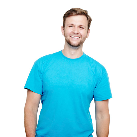 Portrait of a smiling man in blue t-shirt in a studio over a white backgroundの写真素材