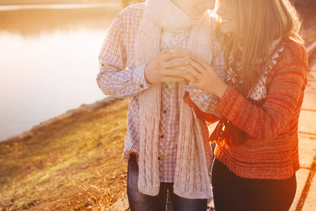 Happy teenage couple having great time together in a sunny day with sunshineの写真素材