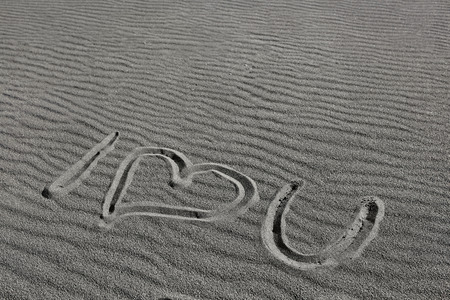 i love you, drawn on the sand of a black beach in Iceland. Love symbol written on sand.の写真素材