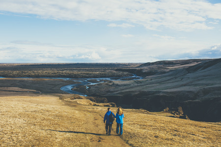Couple walking at Fjadrargljufur canyon in Iceland.の写真素材