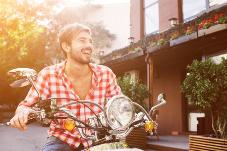 Handsome guy travel. Young rider enjoying the trip. Adventure and vacations concept.の写真素材