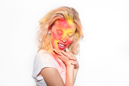 Woman with Holi colors on faceの写真素材