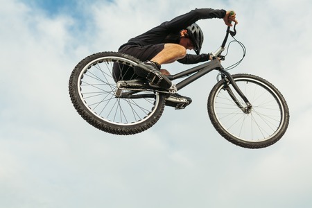 Man jumping on a bikeの写真素材