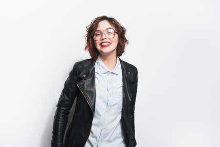 Pretty smiling girl in leather jacketの写真素材