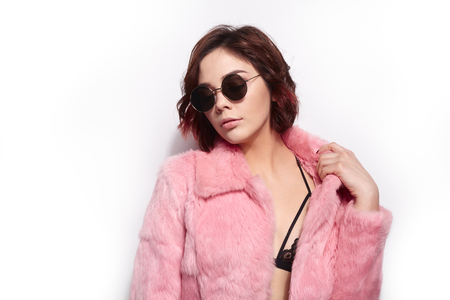 Pretty young woman in sunglassesの写真素材