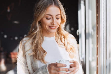 Smiling girl with the beverageの写真素材