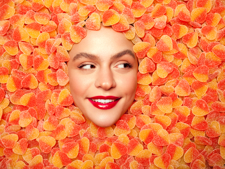 Face of woman in sweetsの写真素材