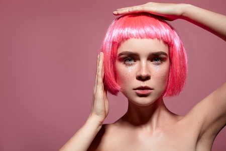 Woman with fashionable hairdo and makeupの写真素材