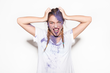 Young expressive female with face paintedの写真素材