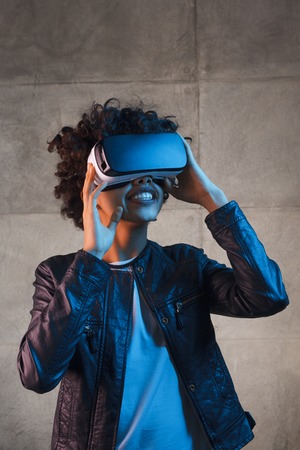 Smiling female enjoying VR gogglesの写真素材