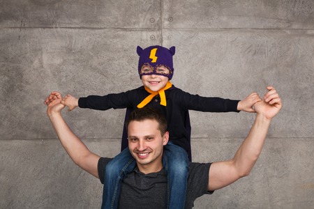 Happy father with kid in costumeの写真素材