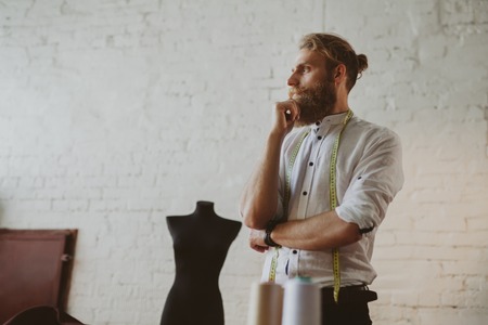 Pensive tailor posingの写真素材