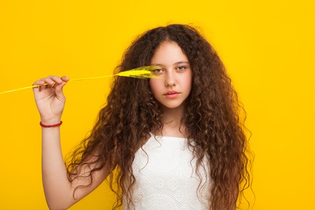 Model with piece of wheatの写真素材