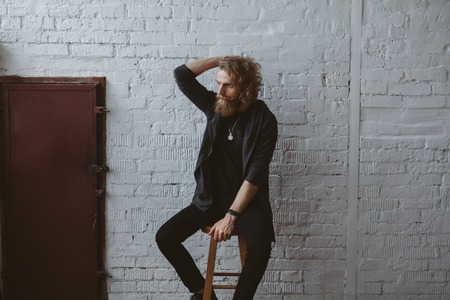 Trendy male designer on chairの写真素材