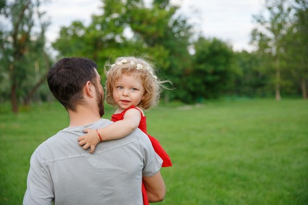 Father holding his little daughterの写真素材