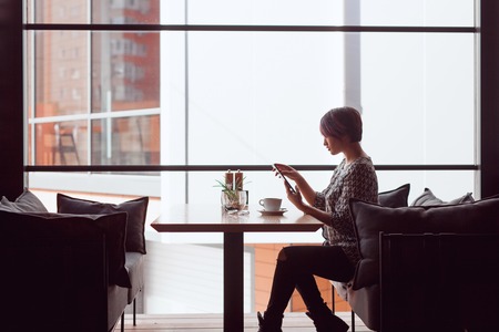 Elegant woman in cafeの写真素材