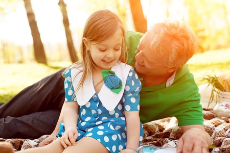 Cheerful girl with grandfatherの写真素材