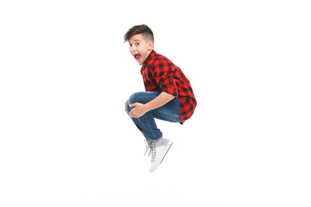 Cheerful jumping boyの写真素材