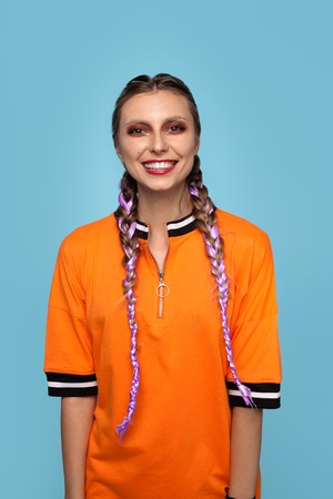 Hipster woman with braids on blue