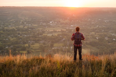 Anonymous traveler posing on landscape
