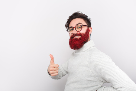 Bright bearded man in glitters gesturingの写真素材