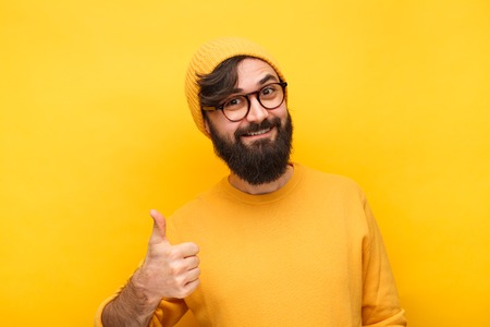 Content hipster showing thumb up