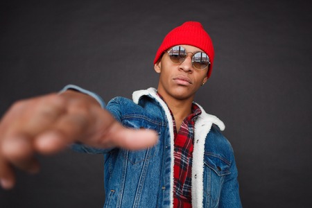 Confident provocative guy posing at camera