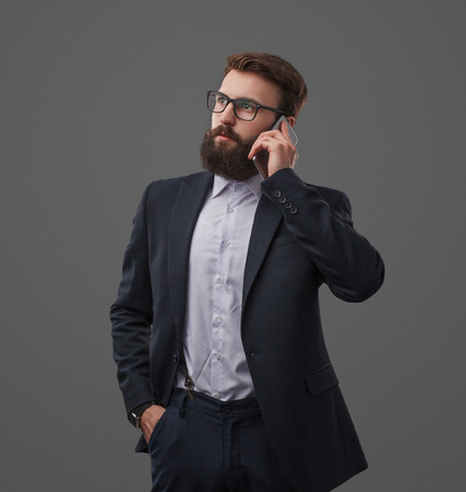 Elegant businessman having phone callの写真素材