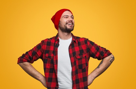 Proud laughing man with hands on waistの写真素材