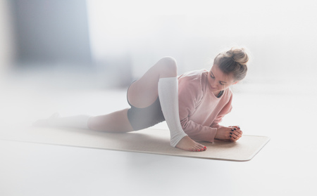 Young woman doing yoga exercise