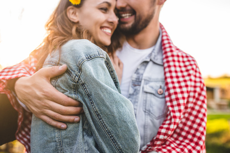 Crop couple hugging in natureの写真素材