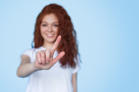 Blurred woman interacting with invisible screen