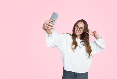 Stylish modern woman taking selfieの写真素材
