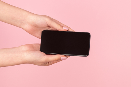 Woman offering modern smartphoneの写真素材