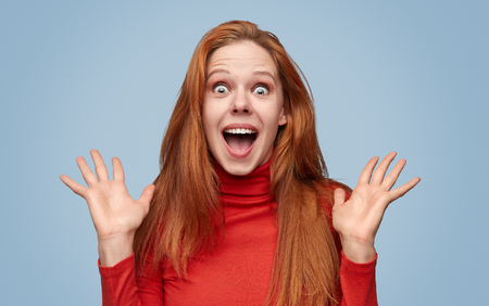 Amazed girl in great surpriseの写真素材