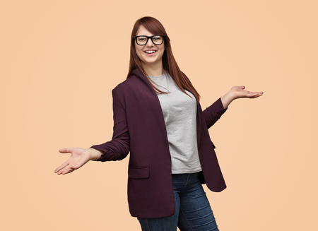 Laughing woman with hands apartの写真素材