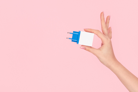 Crop hand showing USB plug