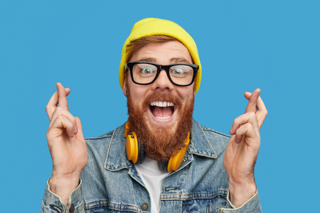 Excited hipster wishing to win lottery