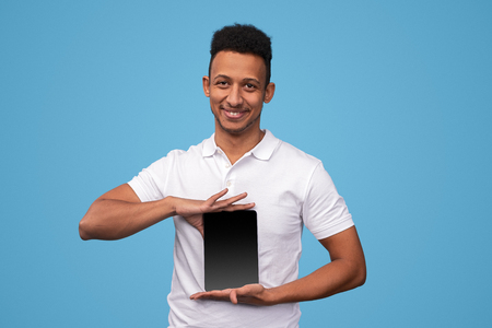 Crazy black male presenting tabletの写真素材
