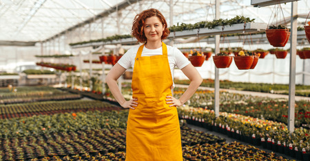 Young female as business owner of greenhouseの写真素材