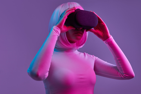 Futuristic female exploring cyberspaceの写真素材