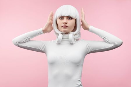 Female cyborg with hands near head