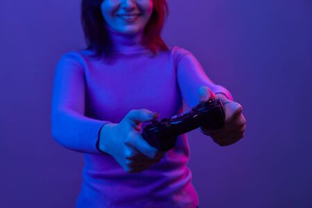 Crop female playing video games