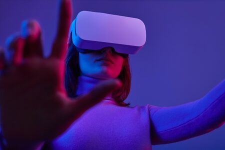 Futuristic woman interacting with data in cyberspaceの写真素材