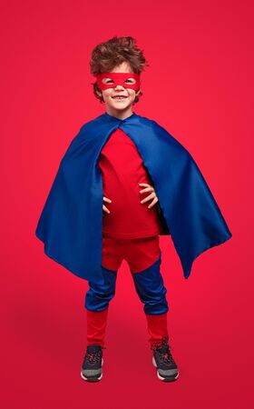 Positive superhero smiling for cameraの写真素材