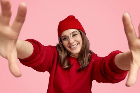 Smiling teen hipster taking selfie