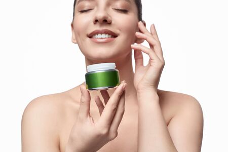 Crop model enjoying face creamの写真素材