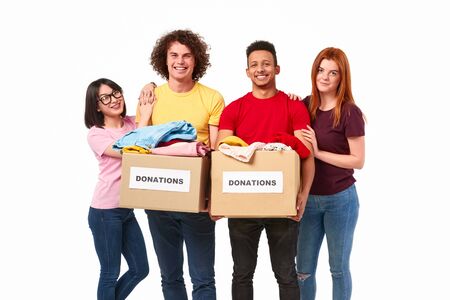 Cheerful multiethnic volunteers with donationsの写真素材